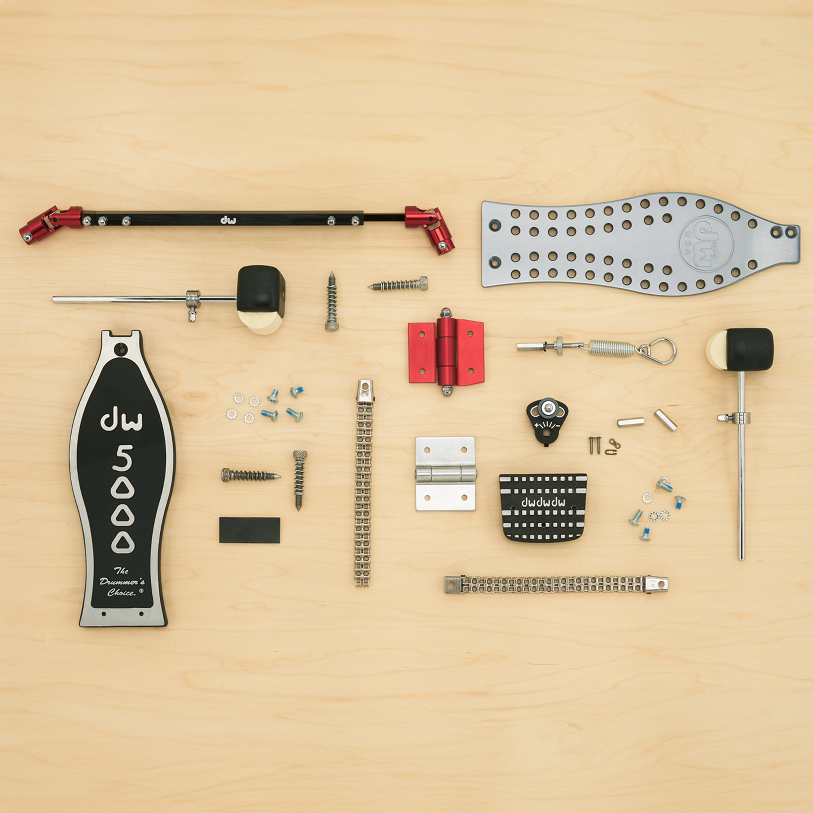 A collection of DW pedal parts including footboards, beaters, bearings, chains, heel plates, and more.