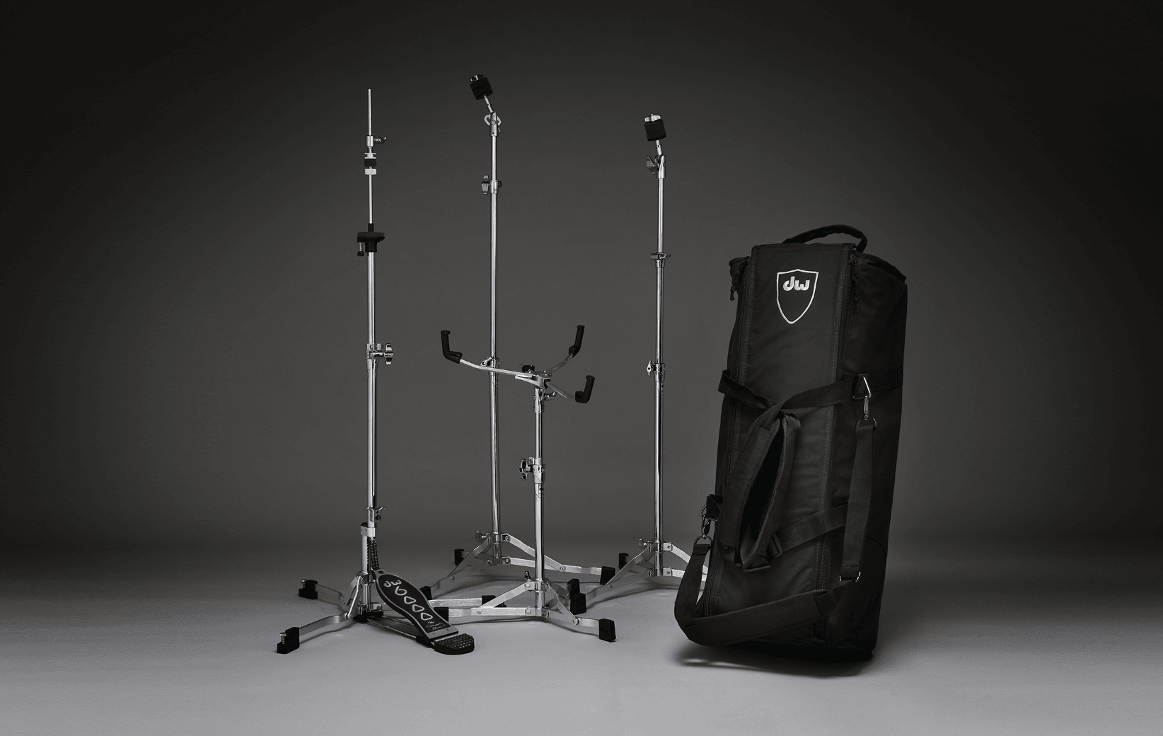 A complete low-profile DW 6000 hardware pack with hi-hat, snare, and straight cymbal stands.