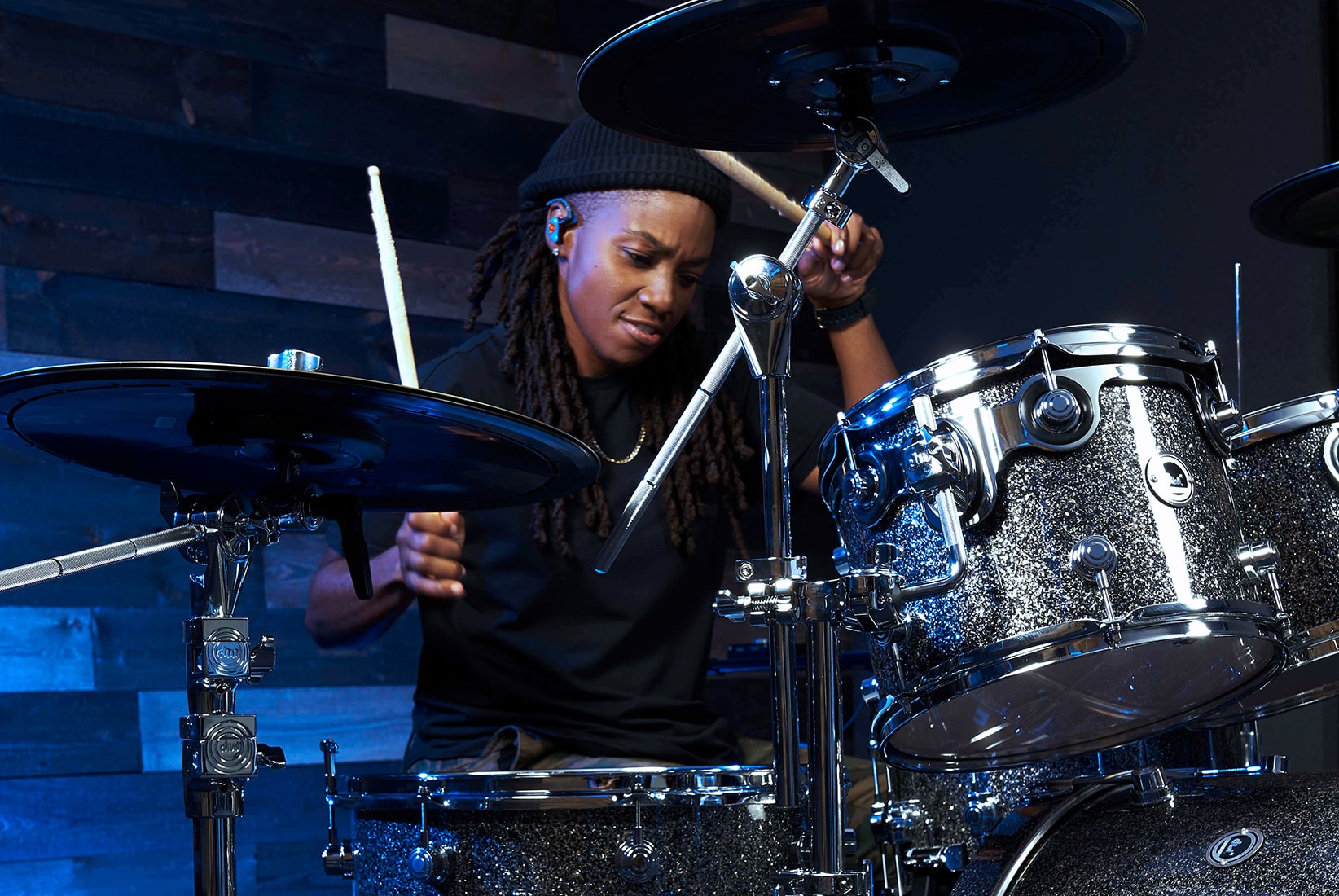 DW artist Patty Anne Miller playing a Black Galaxy DWe drum kit
