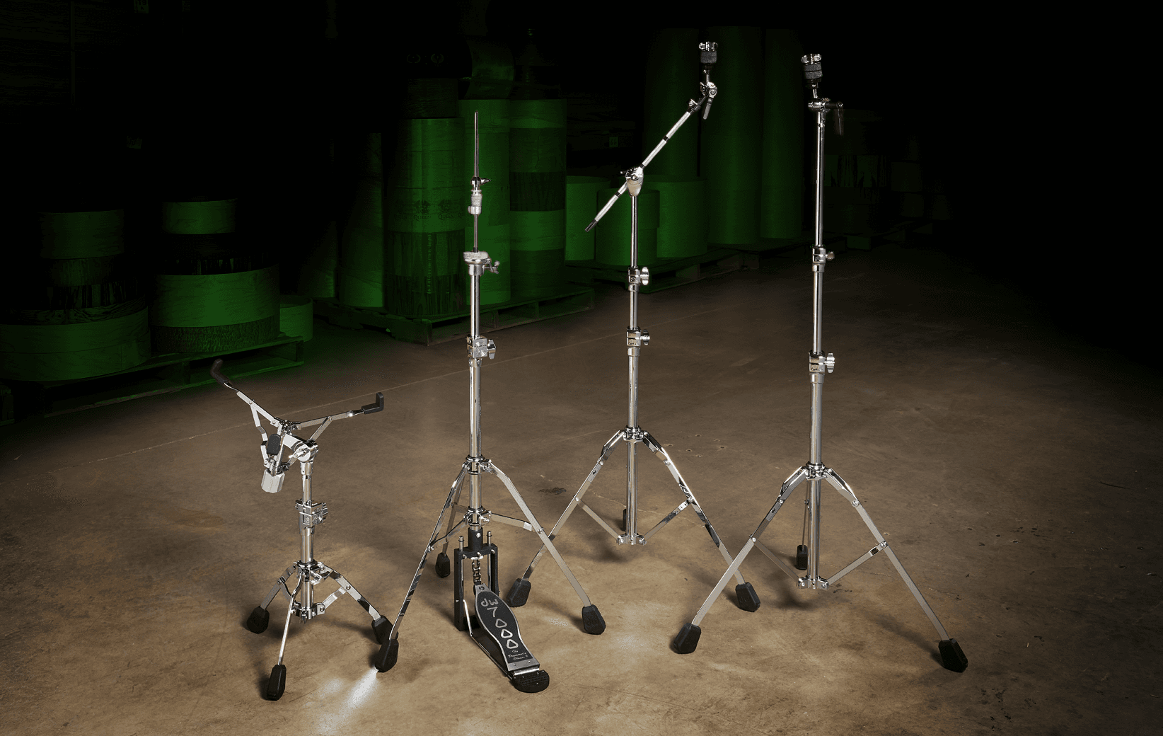 A lineup of the single-braced DW 7000 Series hardware line including a telescoping snare stand, hi-hat stand, boom stand, and straight stand.