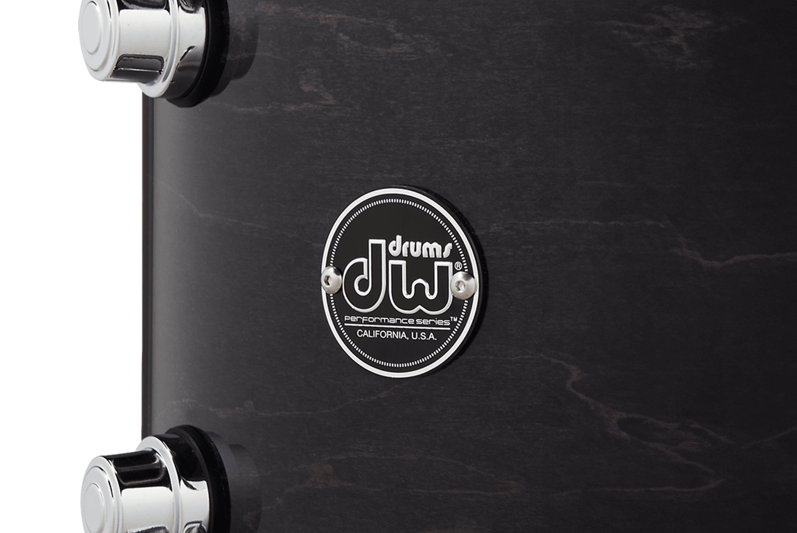 DW Performance Series badge on an ebony stain tom