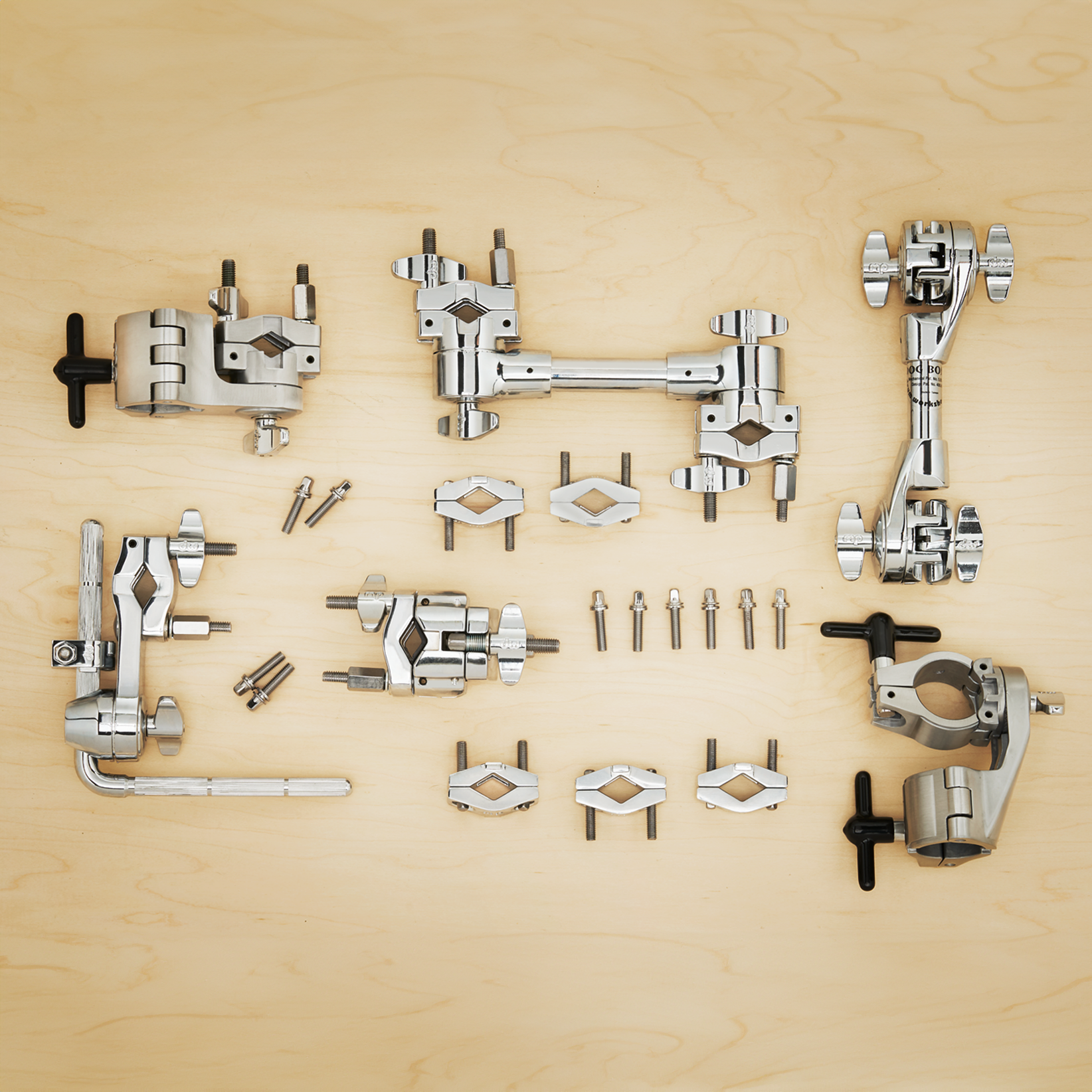 This spread of clamps includes dogbones, memory locks, accessory arms, and various replacement parts.