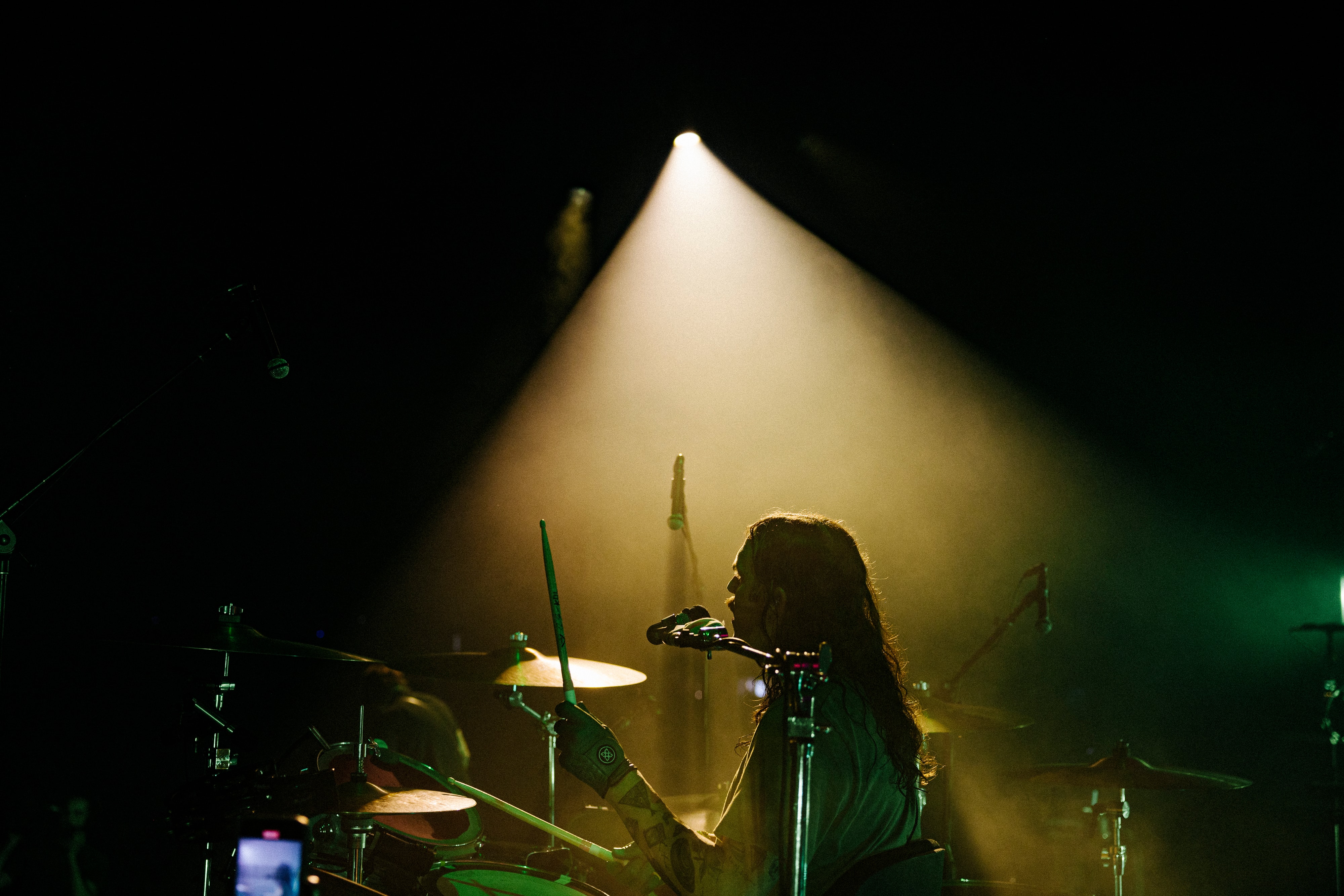 Nathan Followill plays drums in the dark